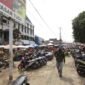 Pedagang menempati lahan parkir Pasar Tugu, Tanjungkarang Timur, Selasa (29/3). Foto: Netizenku.com 