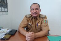 Kepala UPTD PPPA Provinsi Lampung, Amsir, ketika diwawancarai di Kantornya, Senin (30/10). Foto: Luki. 