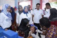 Pj Bupati Tubaba M Firsada menghadiri kegiatan intervensi serentak pencegahan stunting di Tiyuh Marga Kencana, Kecamatan Tulangbawang Udik. (Arie/NK)