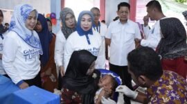 Pj Bupati Tubaba M Firsada menghadiri kegiatan intervensi serentak pencegahan stunting di Tiyuh Marga Kencana, Kecamatan Tulangbawang Udik. (Arie/NK)
