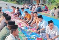 Tasyakuran warga menandai berakhirnya era jalan terjal yang menyulitkan aktivitas sehari-hari di Kelumbayan.